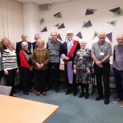 A group of volunteers have been given an award for their long service.