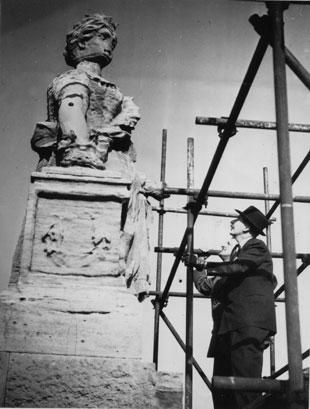 The bust of Victoria atop the Lyceum Theatre, Newport is inspected. 