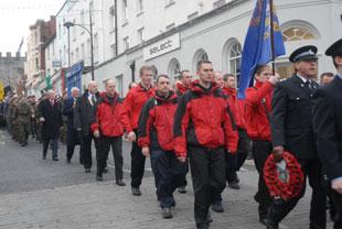 Members of SARA (Severn Area Rescue Association) march towards the cenotaph at Chepstow on Sunday 
