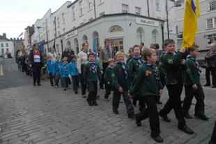 The 1st Bulwark Scouts march towards the Cenotaph at Chepstow on Sunday