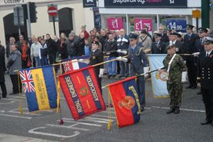 Standards are lowered at the Cenotaph at Chepstow on Sunday