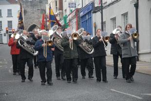 Bream Silver Band and Chepstow Town Band march towards the Cenotaph at Chepstow on Sunday