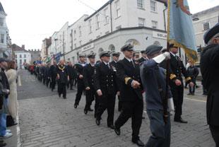 Submariners from HMS Turbulent march towards the Cenotaph at Chepstow on Sunday