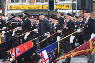 Standards are lowered at the Remembrance parade at the Cenotaph Clarence Place, Newport