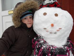 Kian-Rhyd and his snowman. K P Davies, Bettws