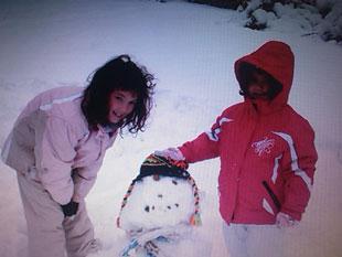 Jade and Madisyn Harris building snowman in Monmouth.
