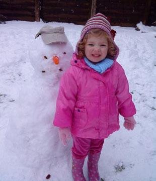 My granddaughter Talia and her snowman. From Paula Tennant.

