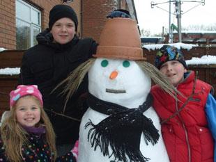 Daniel, Jake and Carys Sims (and the snowman).