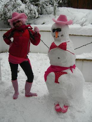 I've attached a picture of 

my daughter Katie Edwards 

with her snowman created 

yesterday.
 
Kind regards
 
Cath Edwards 