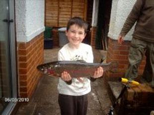 The one that "did not get away from Bampi" 
 
This Rainbow Trout, held by Morgan Daniel Hando was the largest catch on the opening day of the new season of fishing at Ynysfro Reservoir.  A catch of 4lb 10oz by Morgan's Bampi, Brian Wareham.  The catch 