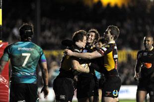 Celebrations after Matthew Watkins scores for the Dragons