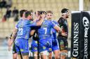 FINALLY: The Dragons celebrate one of their sevens tries in the win at Zebre