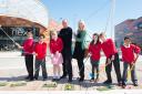 STREET GOLF: Mark Mouland with Victoria Holloway, marketing & PR manager for Queensberry Real Estate, and some of the children who took part in the event. Picture: Matthew Horwood