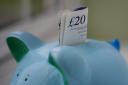 File photo dated 06/01/15 of money in a piggy bank, as Prime Minister David Cameron announced that low-paid workers who put money away in a new savings scheme will be rewarded with a bonus of up to Â£1,200. PRESS ASSOCIATION Photo. Issue date: Monday