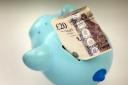 File photo dated 06/01/15 of money in a piggy bank. Pension savers' money will have stronger protections as a new law to drive up standards in schemes used by millions of people to save for retirement has come into force. PRESS ASSOCIATION Photo. Issu