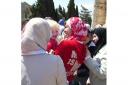 SYRIAN SNAP-HAPPY: My daughter Carys surrounded by Syrian schoolgirls