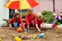 SANDS OF TIME: Trellech Primary School pupils, left to right, Ellie Price, Boris Hale and Harry Thorpe, all five, with the sand