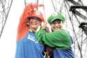 HIGH HOPES: ‘Mario Brothers’ Susan Peck, left, and Leneasha Lewis complete their abseil