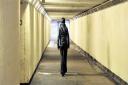 SCENE OF ATTACKS: A woman walks alone through the underpass near Newport railway station Picture posed by model
