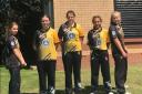Players from Newport cricket club's under-13 girls' team show off the new shirt sponsor.