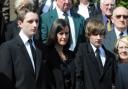 Kingsley Monk's wife Deb Monk and her children Matthew, left and Rhys