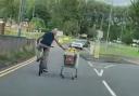 Watch: cyclist pushes trolley of groceries down busy Cwmbran street