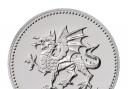 A commemorative £20 coin with a Welsh dragon design has been released by the Royal Mint