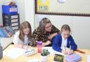 Teaching: Brady Edwards with two of her pupils