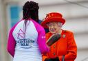 The Queen passing the baton to Kadeena Cox to start the Birmingham 2022 Queen's Baton Relay.