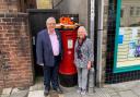 Cwmcarn Post Office worker Liz Howells, pictured here with former councillor Ken James, is retiring.