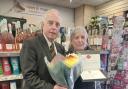 Lynn Hobbs (pictured with Post Office Area Manager Ceri James) has retired after 40 years as the local convenience store owner
