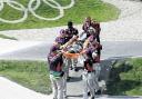 OLYMPIC DUTY: Nurse Jess Arthurs, circled, and her medical colleagues stretcher off a BMX rider injured in one of the heats