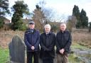 COMMEMORATION: Private Jobbins’ great grandsons (from left) Alan Cook, Mansel Young and Terry Young at the grave