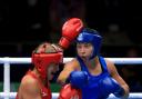 MEDAL: Bargoed boxer Lauren Price, right, in dominant action against Australia's Kaye Scott