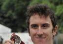 FLAG BEARER: Geraint Thomas today added road race gold to the time trial bronze he won on Thursday