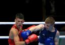 DEFEAT: St Joseph's boxer Joe Cordina, left, gets caught by Scotland's Charlie Flynn