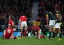 Wales players look dejected at the end of the Rugby World Cup game at Twickenham Stadium, London. PRESS ASSOCIATION Photo. Picture date: Saturday October 17, 2015. See PA story RUGBYU South Africa. Photo credit should read: Gareth Fuller/PA Wire.