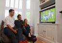 SSE Ultimate Living Room Rugby Party winner Bethan Richardson from Cheltenham who hostyed her part with former Welsh captain and Lions player Ryan Jones - Bethan Richardson watches the game on her new telly with Ryan Jones - 18.10.15Picture by Antony