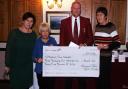 Raglan Parc Golf Club's Jacqueline Fogwill and Alan Edwards (ladies' and club captains) present a cheque for £3,445.20 to Deb Beach and Jill Jeremiah of Meeting The Needs