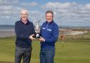 RIVALS: Phillip Price, left, and defending champion Paul Broadhurst with The Senior Open trophy at Royal Porthcawl. Picture: Steve Pope - Sportingwales