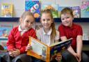 Blaenycwm Primary School of the week.  Reading lessons Taiygan Shannon year 5 (centre) reads to Kai
www.christinsleyphotography.co.ukey Leigh Wood (L) and Kian Roberts (R).
