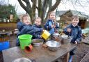 Usk Church in Wales Primary School of the week. Reception in the mud kitchen.  www.christinsleyphotography.co.uk