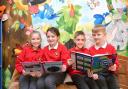 Year 4 reading L-R Ffion Rolph, Alicia Manley, Jake Bennett and George Tavener at Coed Eva Primary who are school of the week . www.christinsleyphotography.co.uk