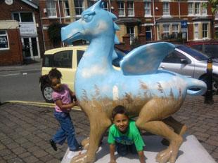 No 16 dragon from St Woolos cathedral with Rico Scarpato age 6 and Alexa Scarpato age 3