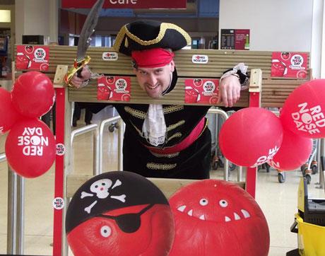 Sainsburys Pontllanfraith have dressed up as Pirates today as part of their Red Nose Day fundraising

Senior managers were put into the stocks this afternoon to have cream pies thrown at them.