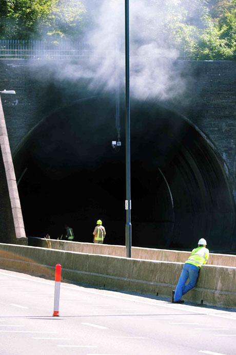 Smoke billows from the westbound entrance of the tunnel. Pic: Malcom Morgan.