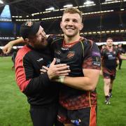 CHANGE: Coach Ceri Jones, pictured on the left with Elliot Dee after the Dragons' Judgement Day win against the Scarlets, is leaving RGC