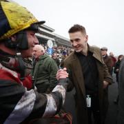 WINNER: Part owner Jonathan Davies congratulates Jack Tudor after his victory in the Coral Welsh Grand National