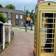 The gold painted phone box in Ystrad Mynach