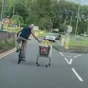 Watch: cyclist pushes trolley of groceries down busy Cwmbran street